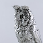 Sterling silver long-eared owl model on an ebonised plinth