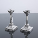 Pair of small Edwardian Corinthian-style sterling silver candlesticks