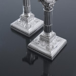 Pair of small Edwardian Corinthian-style sterling silver candlesticks