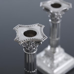 Pair of small Edwardian Corinthian-style sterling silver candlesticks