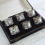 Set of six Victorian pierced sterling silver napkin rings