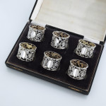 Set of six Victorian pierced sterling silver napkin rings