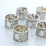 Set of six Victorian pierced sterling silver napkin rings