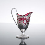 Victorian pierced sterling silver & cranberry glass cream jug