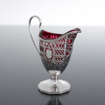 Victorian pierced sterling silver & cranberry glass cream jug