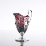 Victorian pierced sterling silver & cranberry glass cream jug