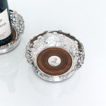 Pair of Victorian pierced & vine-decorated sterling silver wine coasters