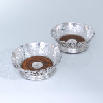 Pair of Victorian pierced & vine-decorated sterling silver wine coasters