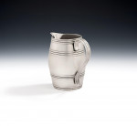 A rare George III "Barrel" Milk Jug made in London by George Smith in 1783.