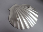 A fine pair of George III Butter Shells made in London in 1777 by Andrew Fogelberg.