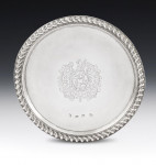 A very important pair of William & Mary Footed Salvers made in London in 1690, Maker's mark of TA with a pellet between