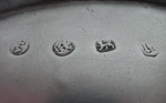 A very important pair of William & Mary Footed Salvers made in London in 1690, Maker's mark of TA with a pellet between