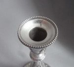 A very rare George III Neo Classical Cast Taperstick made in London in 1781 by Robert Jones, the design attributed to the Royal Architect, Sir William Chambers.