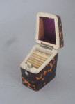 A very rare Tortoiseshell Needle case, unusually modelled as a Georgian Knife Box.  Made in London circa 1840 by Lund of Cornhill, London.