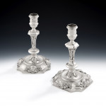 An important, and very unusual, set of four George II Rococo Cast Candlesticks made in London in 1740 by John Swift.