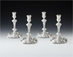 An important, and very unusual, set of four George II Rococo Cast Candlesticks made in London in 1740 by John Swift.