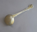 A very fine pair of George III Silver gilt Hourglass pattern sifter spoons made in London in 1806 by William Eley & William Fearn.