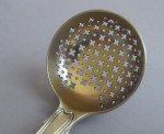 A very fine pair of George III Silver gilt Hourglass pattern sifter spoons made in London in 1806 by William Eley & William Fearn.