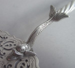 A very fine early George III "Dolphin" handled Serving Slice made in London in 1767 by William Plummer.
