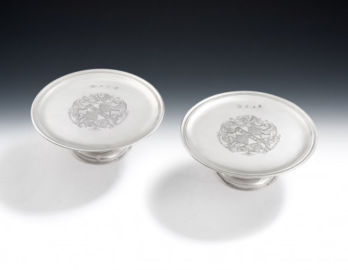 QUEEN ANNE - The Caley Tazzas - A very fine pair of Britannia Standard Tazzas made in London in 1712 by Timothy Ley.