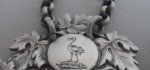 A rare George IV Heraldic Wine Label made in London in 1825 by Charles Rawlings.