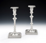 A fine set of four George II Cast Candlesticks made in London in 1756 by John Cafe.