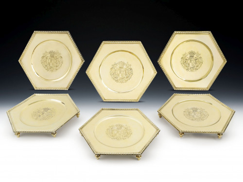 An important set of six Queen Anne Britannia Standard Silver Gilt Hexagonal Salvers.  Made in London in 1704 by David Willaume.
