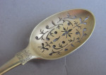 A very rare set of George II silver gilt Teaspoons together with their mote spoon and sugar nips.  All contained within their original case.  All made in London circa 1755.