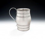 A fine George III "Barrel" Mug made in London in 1779 by John Edwards III & William Frisbee.  The maker's mark of Thomas Daniel overstriking, as retailer.