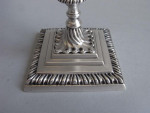 A very rare pair of early George III CAST Tapersticks made in London in 1766 by Ebenezer Coker.