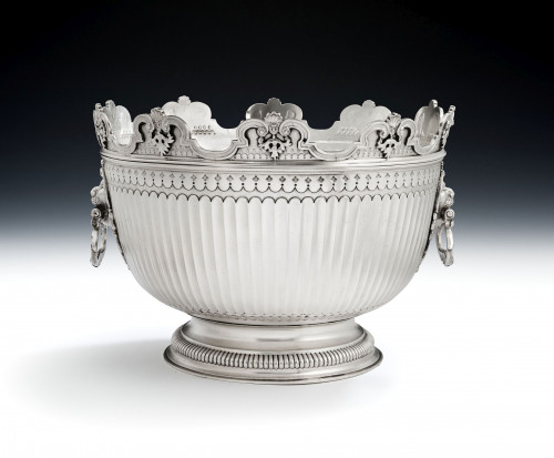 The Baron Guernsey Combination Monteith/Punch Bowl.  An important early Queen Anne Britannia Standard Combination Monteith/Punch Bowl made in London in 1703 by Isaac Dighton.