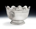 The Baron Guernsey Combination Monteith/Punch Bowl.  An important early Queen Anne Britannia Standard Combination Monteith/Punch Bowl made in London in 1703 by Isaac Dighton.