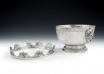 The Baron Guernsey Combination Monteith/Punch Bowl.  An important early Queen Anne Britannia Standard Combination Monteith/Punch Bowl made in London in 1703 by Isaac Dighton.