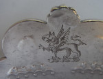The Baron Guernsey Combination Monteith/Punch Bowl.  An important early Queen Anne Britannia Standard Combination Monteith/Punch Bowl made in London in 1703 by Isaac Dighton.