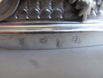 The Baron Guernsey Combination Monteith/Punch Bowl.  An important early Queen Anne Britannia Standard Combination Monteith/Punch Bowl made in London in 1703 by Isaac Dighton.