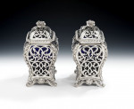 An extremely rare pair of Glass and silver Cagework Tea Caddies made in London in 1845 by William Cooper.