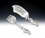 A very rare and exceptionally fine pair of fish servers, both made in London, the fish slice made by Theobald and Atkinson in 1838 and the Fork in 1889 by Aldwinkle & Slater,