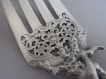 A very rare and exceptionally fine pair of fish servers, both made in London, the fish slice made by Theobald and Atkinson in 1838 and the Fork in 1889 by Aldwinkle & Slater,