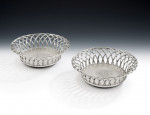 A very rare set of four early George III Wirework Silver based Magnum Wine Coasters made in London in 1764 by John Henry Vere & William Lutwyche.