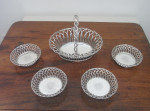 A very rare set of four early George III Wirework Silver based Magnum Wine Coasters made in London in 1764 by John Henry Vere & William Lutwyche.