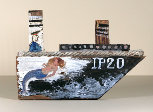 Painted driftwood model boat