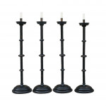 A Set Of four Large Floor Standing Candlesticks