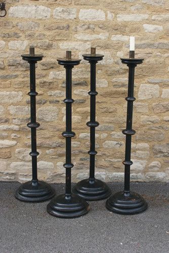 A Set Of four Large Floor Standing Candlesticks