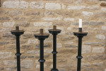 A Set Of four Large Floor Standing Candlesticks