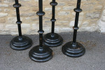 A Set Of four Large Floor Standing Candlesticks