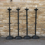 A Set Of four Large Floor Standing Candlesticks