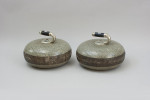 A Pair Of Engraved Curling Stones