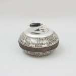 A Ceramic Curling Stone Shape Tobacco Jar Biscuit Barrel