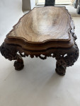 A C19th carved low Italian carved walnut table with onyx top