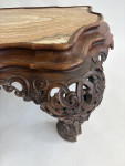 A C19th carved low Italian carved walnut table with onyx top
